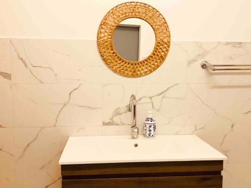 a bathroom with a sink and a mirror at Channel View in Blacksmiths