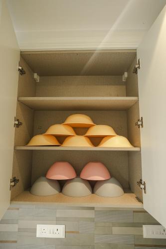 a closet filled with lots of different colored eggs at VILLA M- SAVANNAH 7- 5BHK Brand New Villa in Calangute with Private Pool, Near Beach, free Breakfast, north goa in Goa