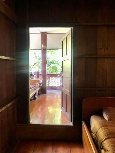 a view of a room with a window in a house at Ban Kaew Mo Ra Glamping & Restaurant in Pang Mapha