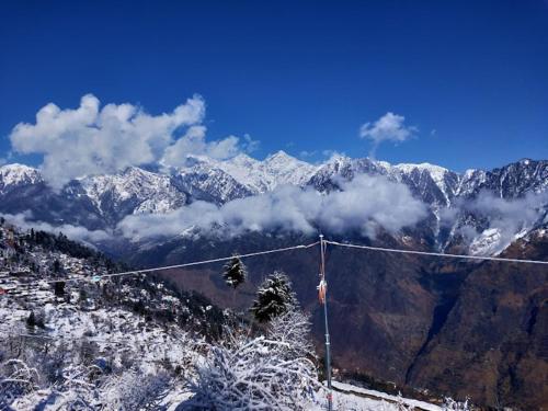 a view of a mountain with snow covered mountains at Morning Glory Camping and trekking in Joshīmath