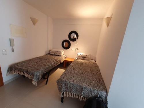 Giường trong phòng chung tại Apartamento Golden Sun