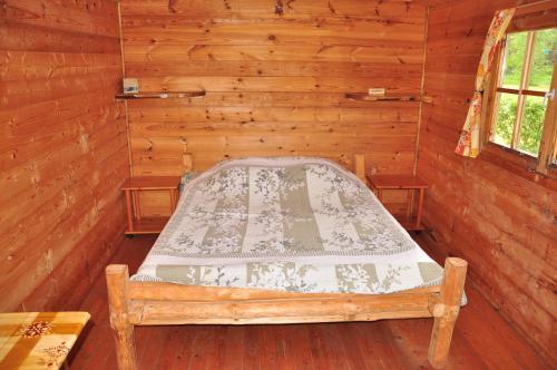 Ένα ή περισσότερα κρεβάτια σε δωμάτιο στο Campsite Leiputrija