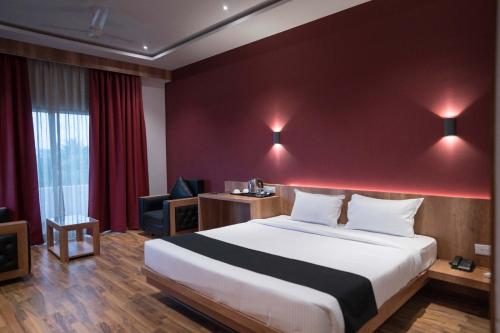 Postel nebo postele na pokoji v ubytování TGN SUITES - HOTEL