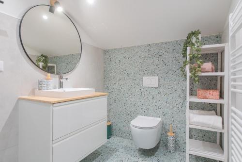 a bathroom with a sink and a mirror at Villa Magnolia with heated Pool and Jacuzzi, near sea in Tugare