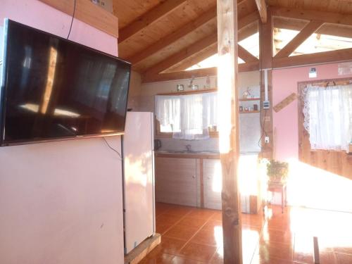TV a/nebo společenská místnost v ubytování Cabaña del Lago 2