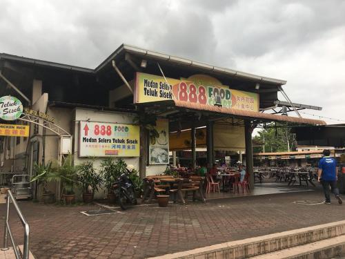a store with signs on the side of a building at Hotel Twelve at 12 Kuantan Centre in Kuantan