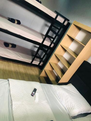 Postel nebo postele na pokoji v ubytování FIRMH HOSTEL Café da manhã e Translado Aeroporto das 06h as 00h incluso