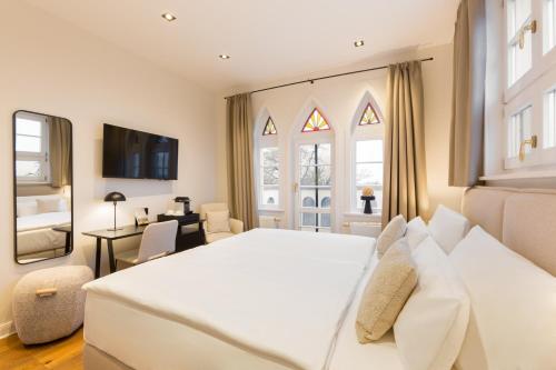 Cama o camas de una habitación en Hotel Künstlerquartier Seezeichen