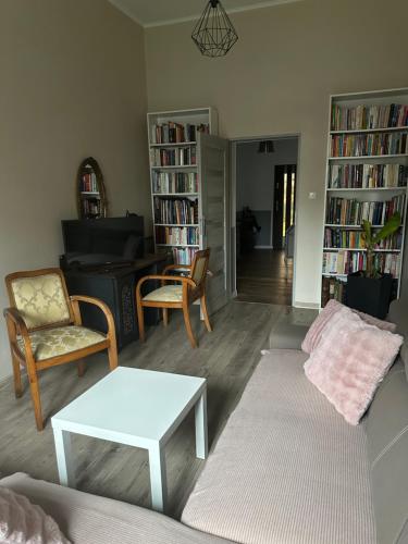 a living room with a couch and chairs and a table at dom nad rzeka in Nysa