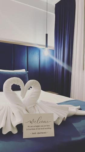 Katil atau katil-katil dalam bilik di Apartments and rooms SMILE