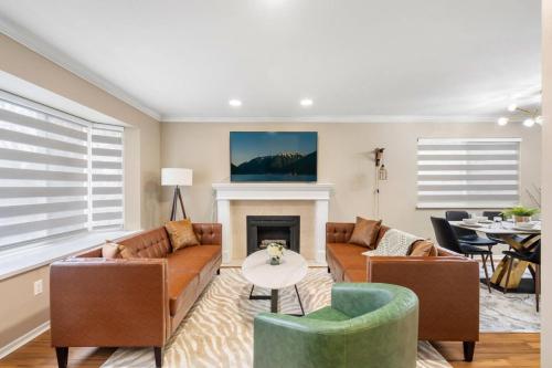 a living room with couches and a fireplace at Spacious Family Retreat Central to YVR and Downtown in Vancouver