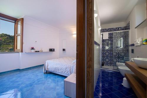 Ένα ή περισσότερα κρεβάτια σε δωμάτιο στο Villa Elica - suite Carmine - Amalfi coast