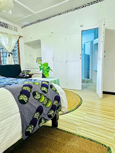 a bedroom with a bed and a rug at Ethiopian restaurant and lodge in Arusha