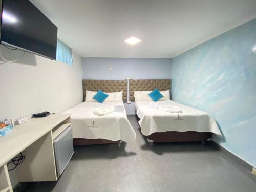 Postel nebo postele na pokoji v ubytování Hotel Jose Ignacio Chepen