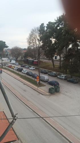 a view of a parking lot with parked cars at Mylos House in Tríkala