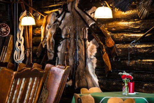 a dining room with a horse head on the wall at Berghotel Blaickner's Sonnalm in Zell am See