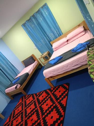 Ένα ή περισσότερα κρεβάτια σε δωμάτιο στο Roomstay Kemuning