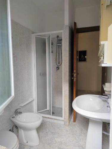 a bathroom with a shower and a toilet and a sink at Casetta Trionfale in Rome