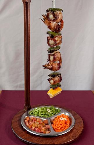 a plate of food on a table with a plate of food at Hospedaria Frangaria in Faro