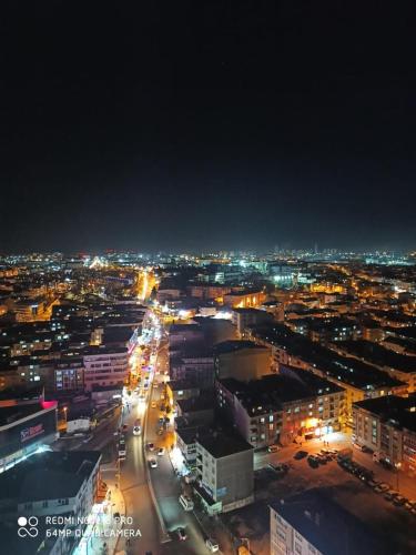 a city lit up at night with traffic at ENTIRE 3 Bedroom Apartment with FREE PARKING in Esenyurt