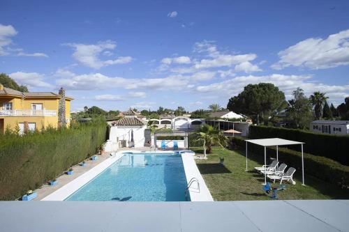 a view of a swimming pool from a house at Charming Villa in Linares with Private Pool in Jaén