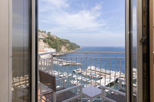 a view of a marina from a balcony at Coltur Suites in Sorrento