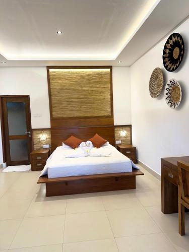 a bedroom with a large bed in a room at Villa Karma Loka in Sidemen