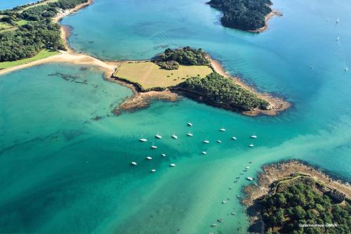 an island in the ocean with boats in the water at Maison médiévale de charme à Baden in Baden