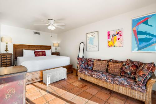 a living room with a bed and a couch at Fanta-Sea 47 By Beachside Management in Siesta Key