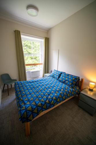 Ένα ή περισσότερα κρεβάτια σε δωμάτιο στο Braemar Youth Hostel