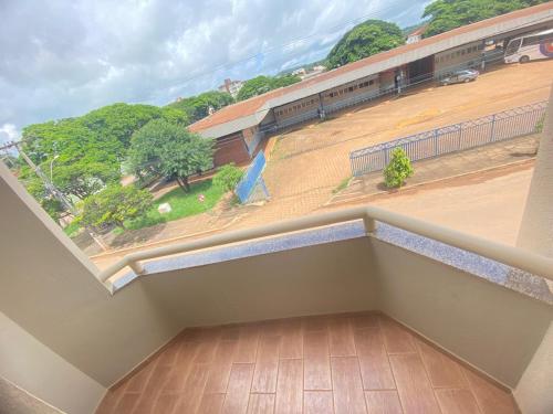 a balcony with a view of a train station at Abaeté Palace Hotel in Abaeté