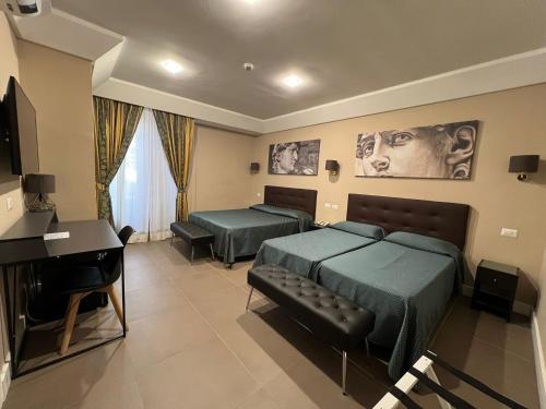 a hotel room with two beds and a piano at Hotel Garda in Rome