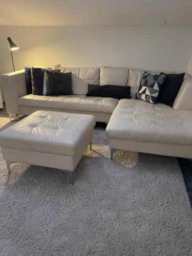a living room with a couch and two couches at B&B Saga in Herning