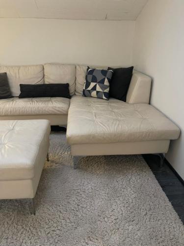 a living room with a couch and a coffee table at B&B Saga in Herning