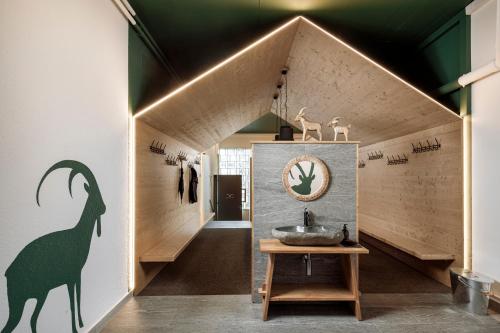 a room with a sink in the middle of a building at Hotel Sport Klosters in Klosters