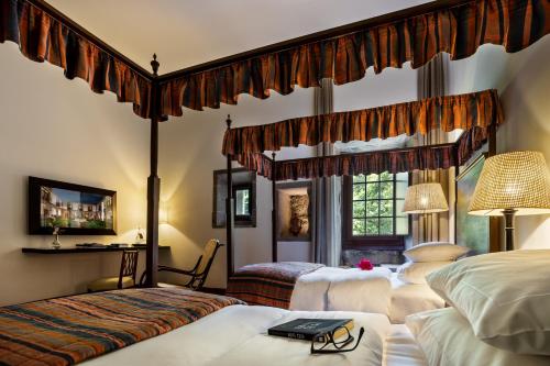 Cama ou camas em um quarto em Pousada Mosteiro de Guimaraes