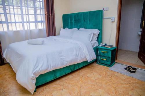 Ένα ή περισσότερα κρεβάτια σε δωμάτιο στο Jama Cosy Homes