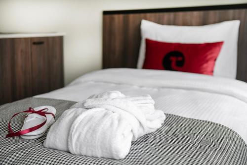 Postel nebo postele na pokoji v ubytování Tauragė Hotel