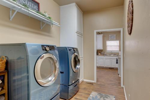 a washer and dryer in a laundry room at Historic Home Half-Mile to Downtown Guthrie! in Guthrie