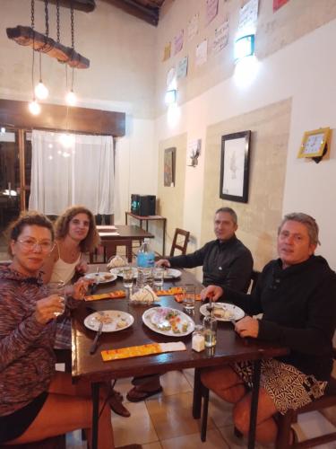 a group of people sitting at a table eating at Hostal Casa Grande in Villazón