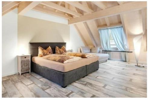a bedroom with a large bed in a room at Landhaus am Schloss in Küps