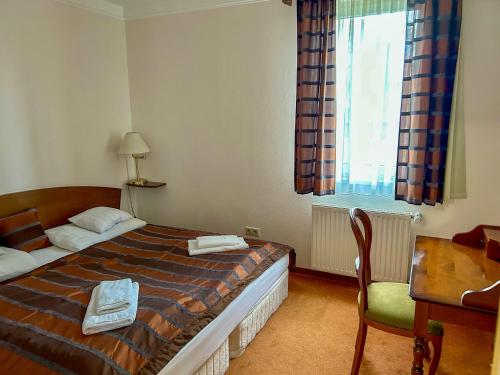 Posteľ alebo postele v izbe v ubytovaní Bernadett Villa Apartman 3