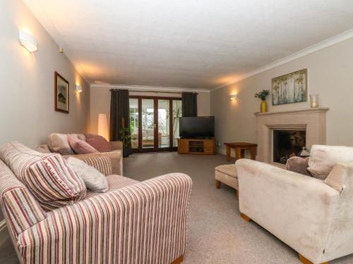 a living room with two couches and a fireplace at The Pines in Skipton
