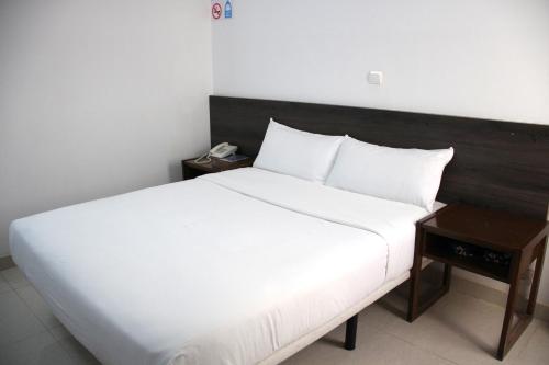 Postel nebo postele na pokoji v ubytování HOTEL NAKHIL