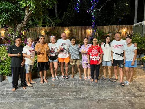a group of people posing for a picture at U OLIVE Hotel in Ban Nua