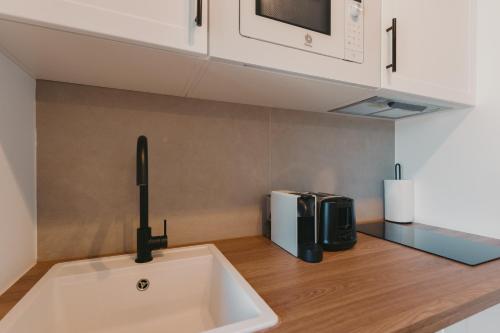 Η κουζίνα ή μικρή κουζίνα στο Apartamentos exclusivos en casco histórico