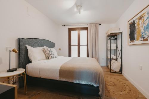 Ένα ή περισσότερα κρεβάτια σε δωμάτιο στο Apartamentos exclusivos en casco histórico