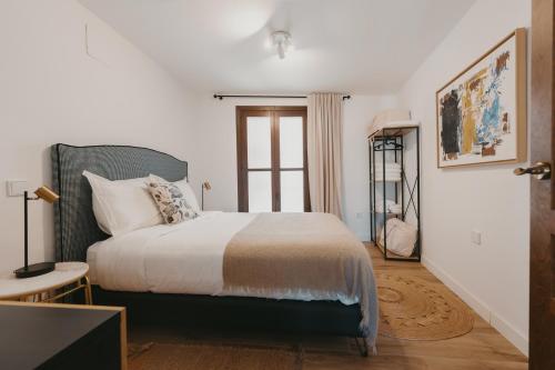 Ένα ή περισσότερα κρεβάτια σε δωμάτιο στο Apartamentos exclusivos en casco histórico