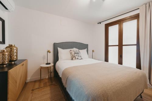 Ένα ή περισσότερα κρεβάτια σε δωμάτιο στο Apartamentos exclusivos en casco histórico