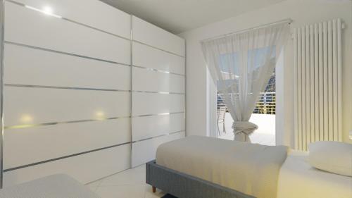 En eller flere senge i et værelse på RivieraRent Charming Villa Alassio with pool and garden